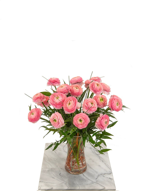 Pink ranunculus bouquet in glass vase for birthdays – Brazos Floral Houston
