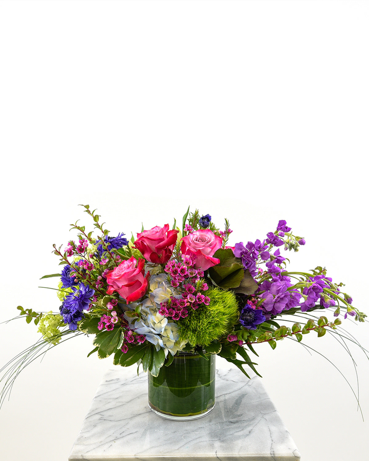 Bright mixed bouquet with pink roses, purple stock, and hydrangeas for celebrations – Brazos Floral Houston
