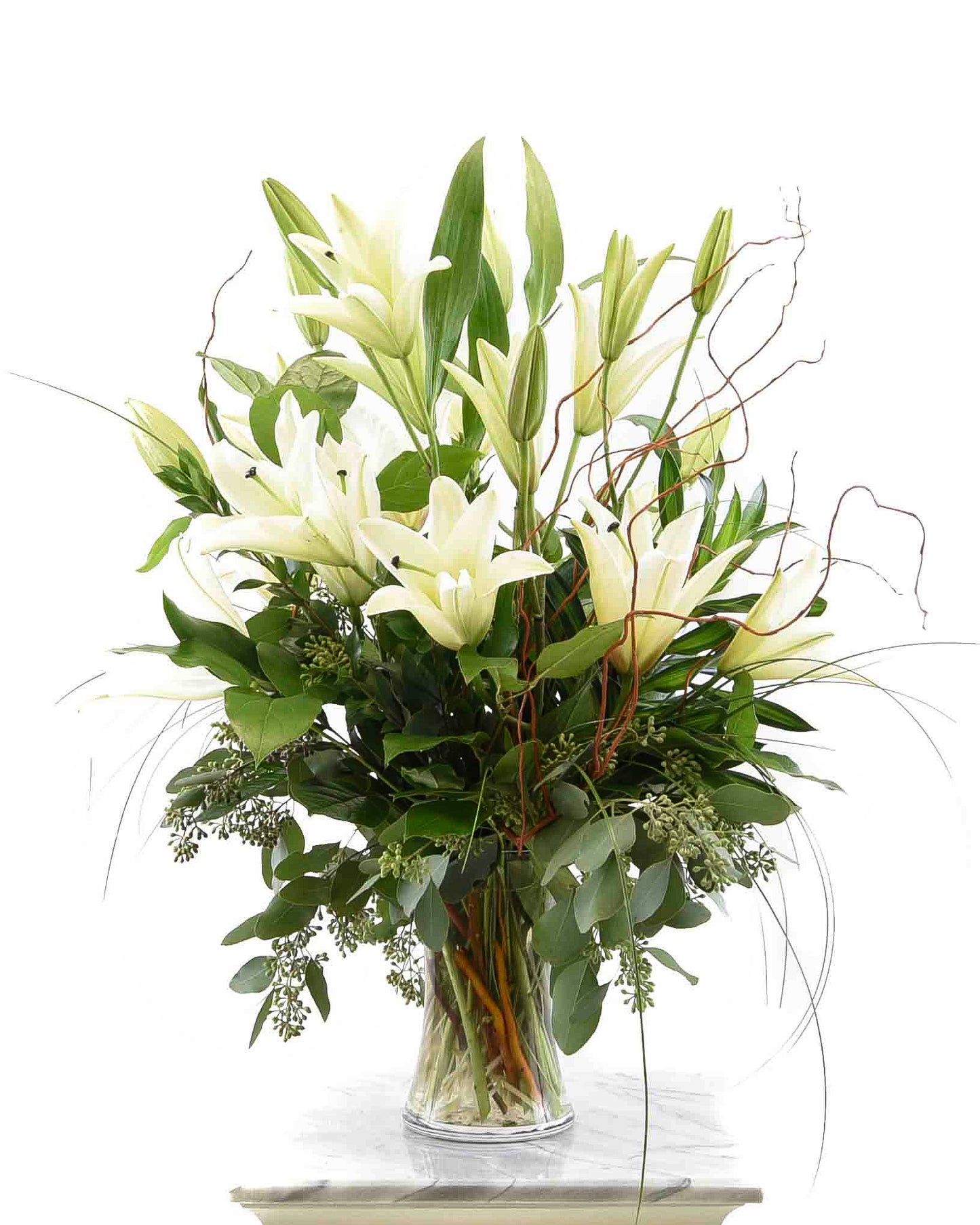 White lily arrangement with greenery for sympathy – Brazos Floral Houston
