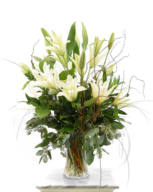 White lily arrangement with greenery for sympathy – Brazos Floral Houston
