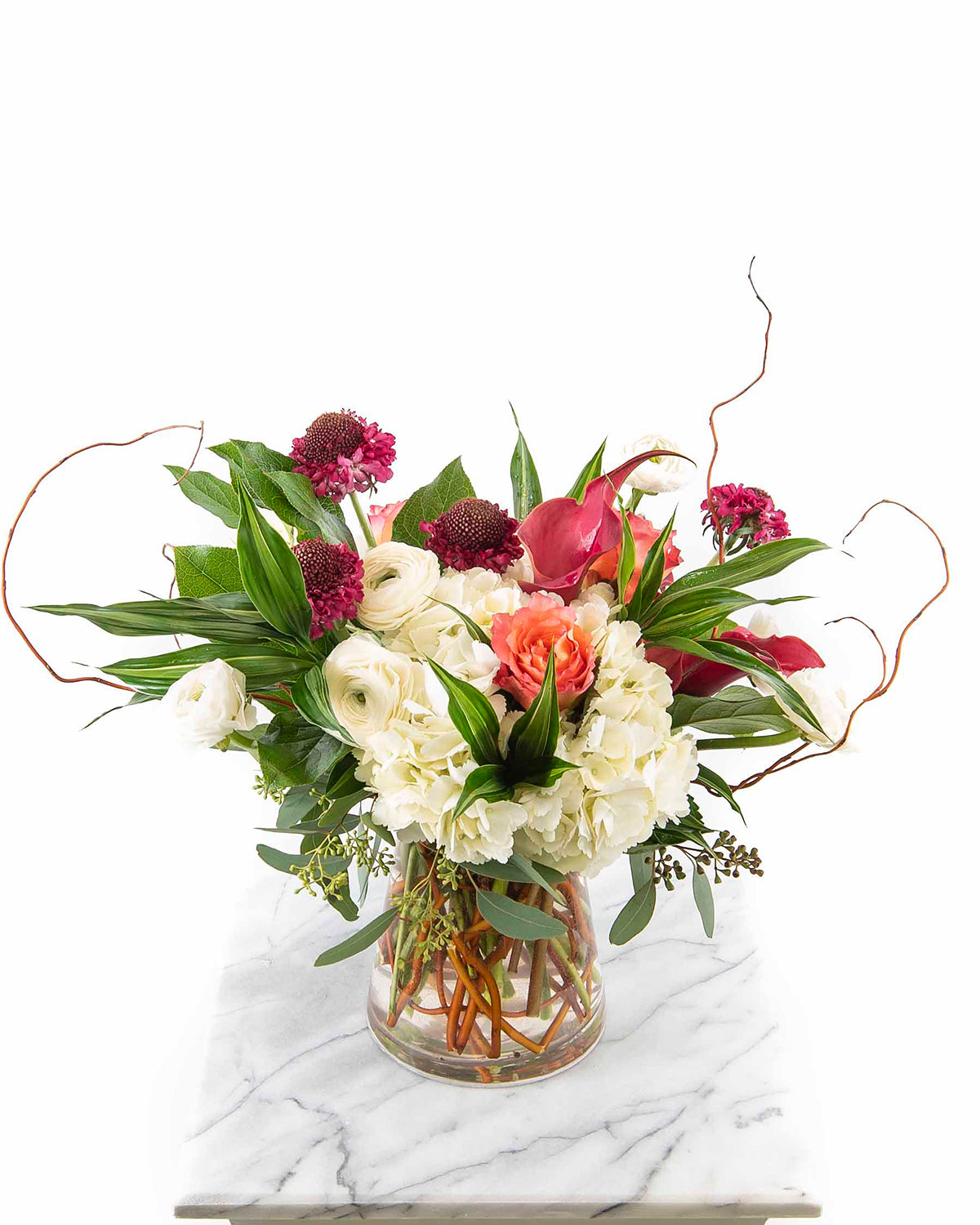 Mixed bouquet with white hydrangeas, coral roses, and burgundy blooms for anniversaries – Brazos Floral Houston
